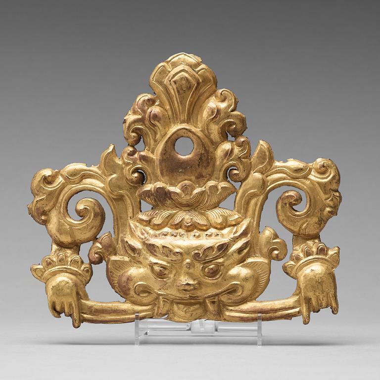 A Tibetan gilt copper alloy repousse decor piece, presumably 19th Century.