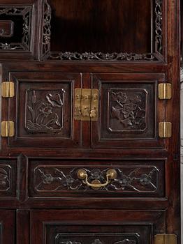 A pair of Chinese hardwood display cabinets, Qing dynasty, 19th Century.