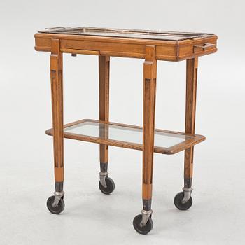 A restaurant serving trolley with silver plate dishes, first half of the/mid 20th century.