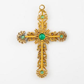 A cross in 14K gold set with faceted emeralds and old-cut diamonds, likely 18th century.