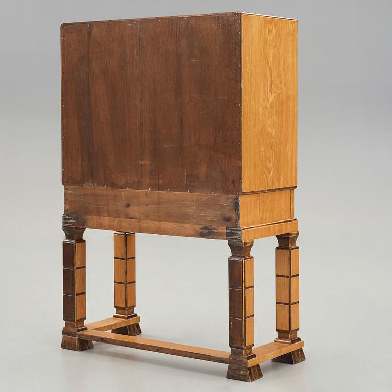 GUSTAV BERGSTRÖM, attributed to, a Swedish Grace cabinet on stand, 1930's.