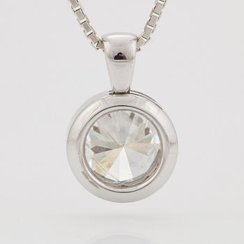 A PENDANT set with a round brilliant-cut diamond.