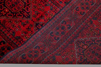 A Afghan runner carpet, 388 x 79 cm.