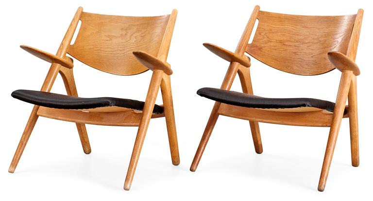 A pair of Hans Wegner easy chairs by Carl Hansen, Denmark, 1950's.