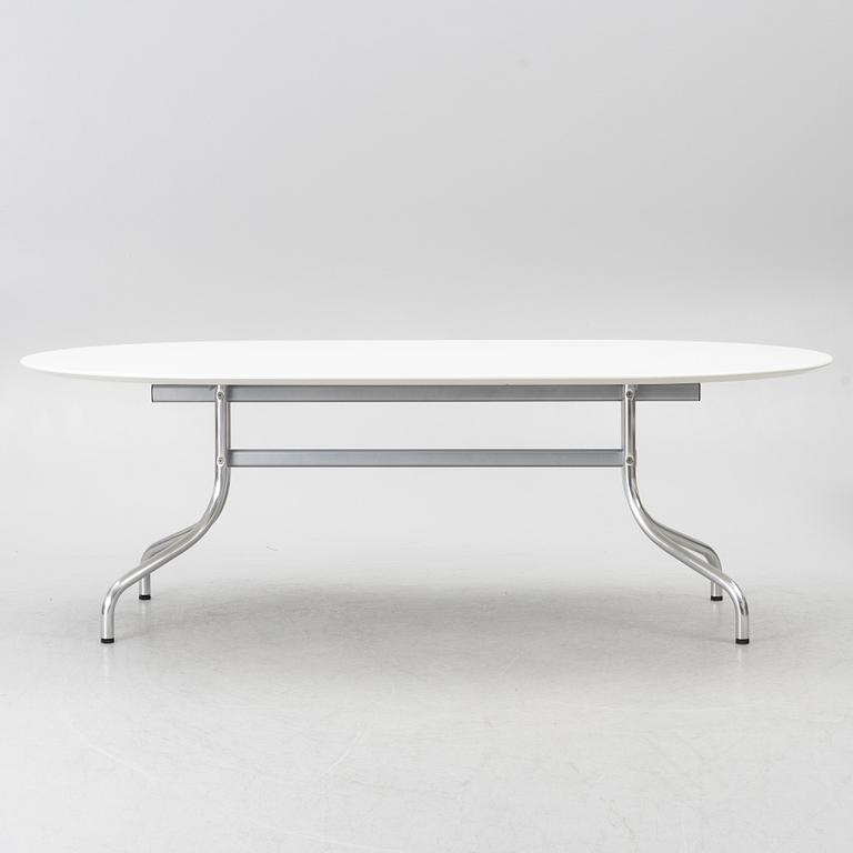 Vico Magistretti, a "Shine" dining table with twelve chairs, De Padova, Italy, around the year 2000.