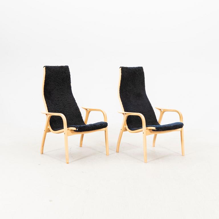 Yngve Ekström, a pair of lamino easy chairs from Swedese later part of the 20th century.