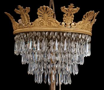An Empire first half 19th century eighteen-light gilt bronze chandelier.
