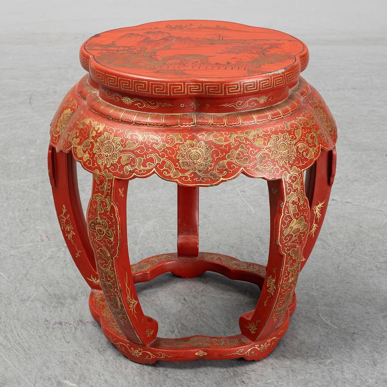 A Chinese red lacquered stool, early 20th century.