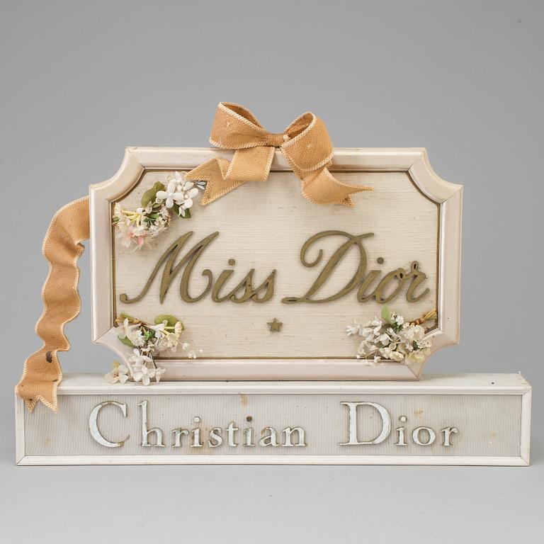 A mid 20th century sign "Miss Dior", Christian Dior.