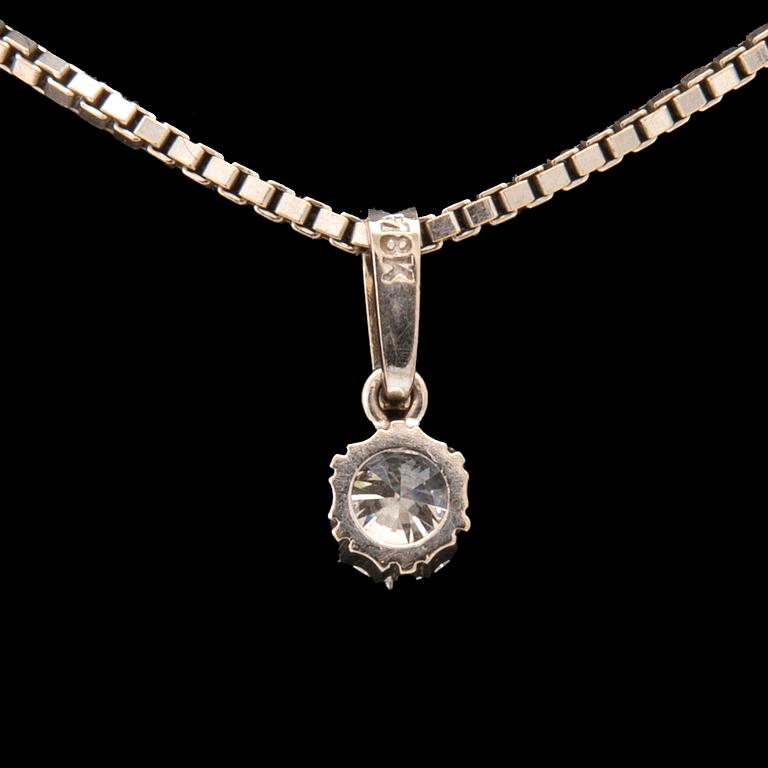 An 18K white gold necklace set with a round brilliant-cut diamond.