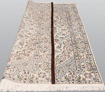 A Nain part silk carpet, 254 x 156 cm.