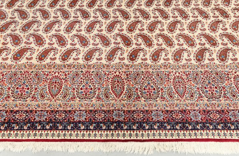 A Kirman carpet, signed, c. 390 x 295 cm.