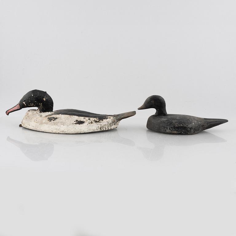 A set of six wooden duck decoys, 20th century.