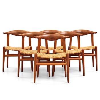 Hans J. Wegner, a set of six teak and rattan "Cowhorn Chairs" "JH-505", executed by cabinetmaker Johannes Hansen, Denmark 1950-60's.