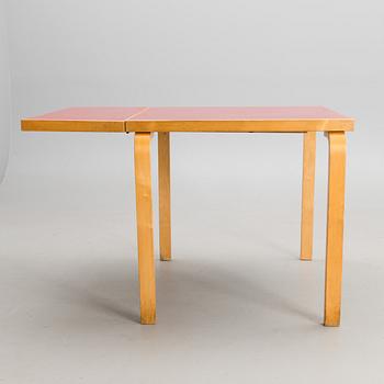 A mid-20th century drop leaf table for Artek Finland.