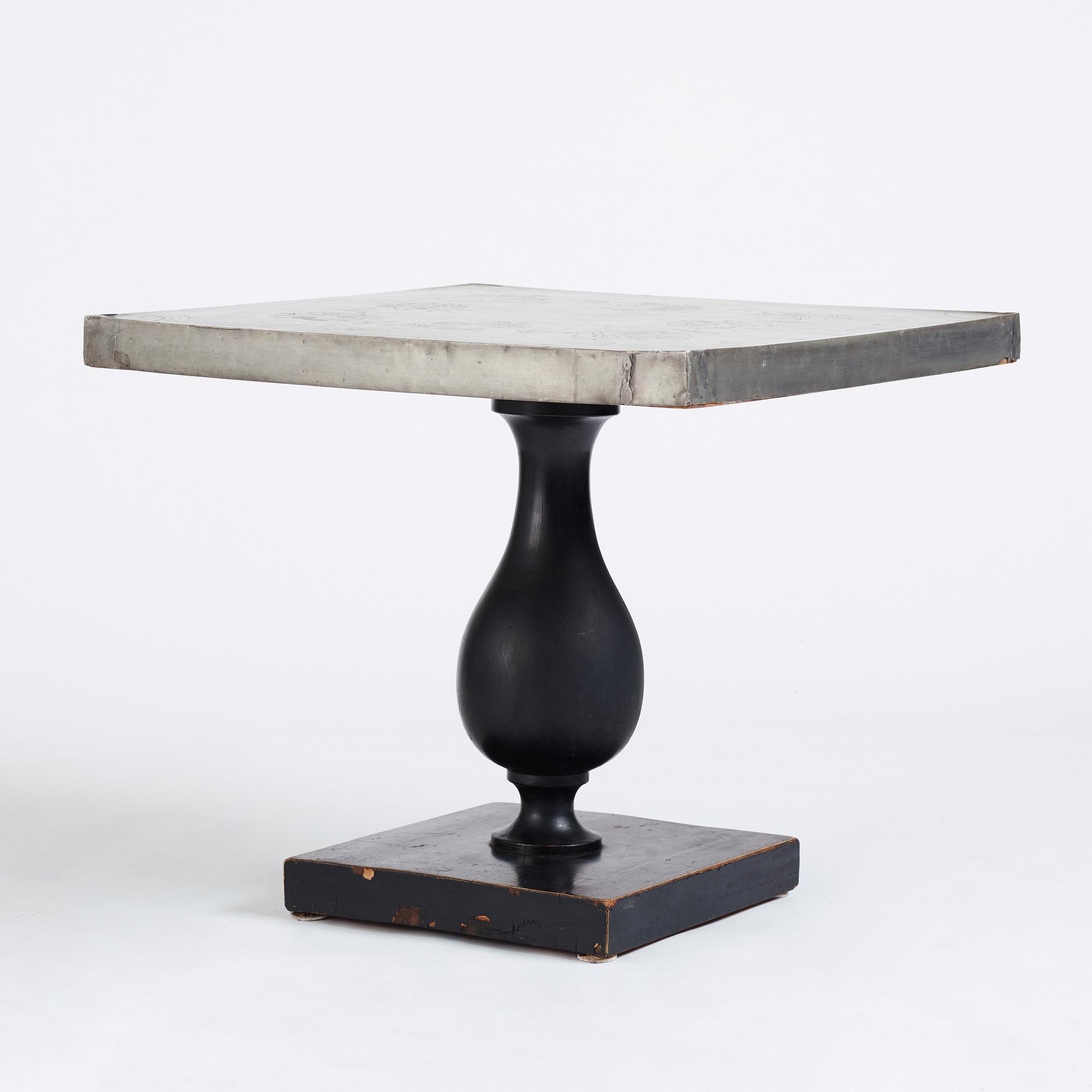 Uno Åhrén, a black lacquered table with a pewter top by Nils Fougstedt, Svenskt Tenn ca 1930. Alva & Gunnar Myrdal Collection.