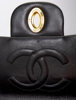 A Chanel maxi jumbo leather bag.