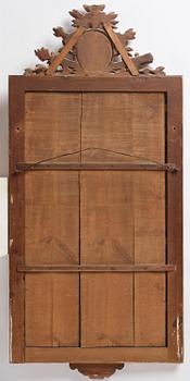 A late-Gustavian carved giltwood mirror by C. Corssar (master in Stockholm 1791-1808).