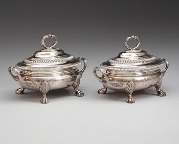 A pair of English 19th century silver sauce tureens, makers mark of Thomas Robins, London 1813-1814.