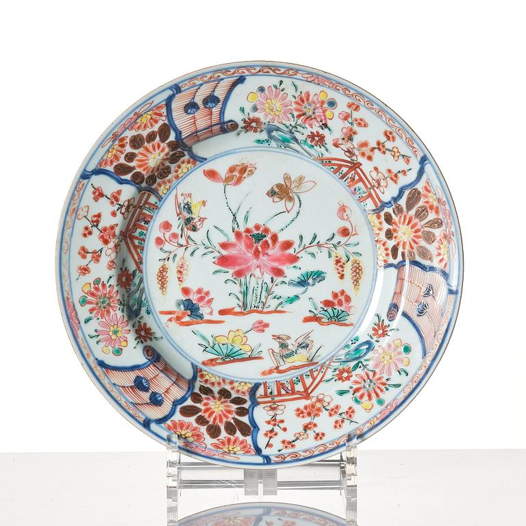 A set of 12 famille rose dinner plates, Qing dynasty, first half of the 18th Century.