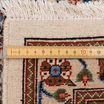 A Moud carpet, part silk, approx. 285 x 195 cm.