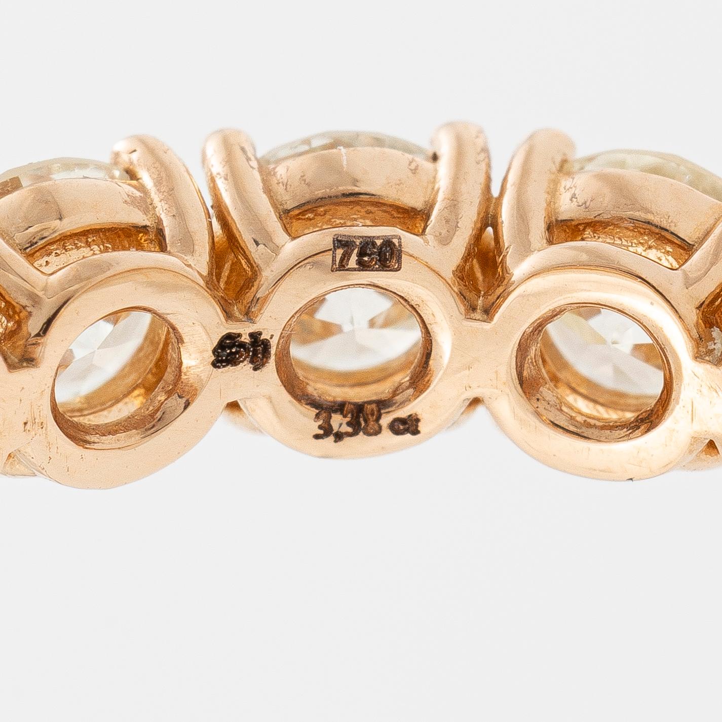 Full eternity ring in 18K rose gold set with brilliant-cut diamonds.