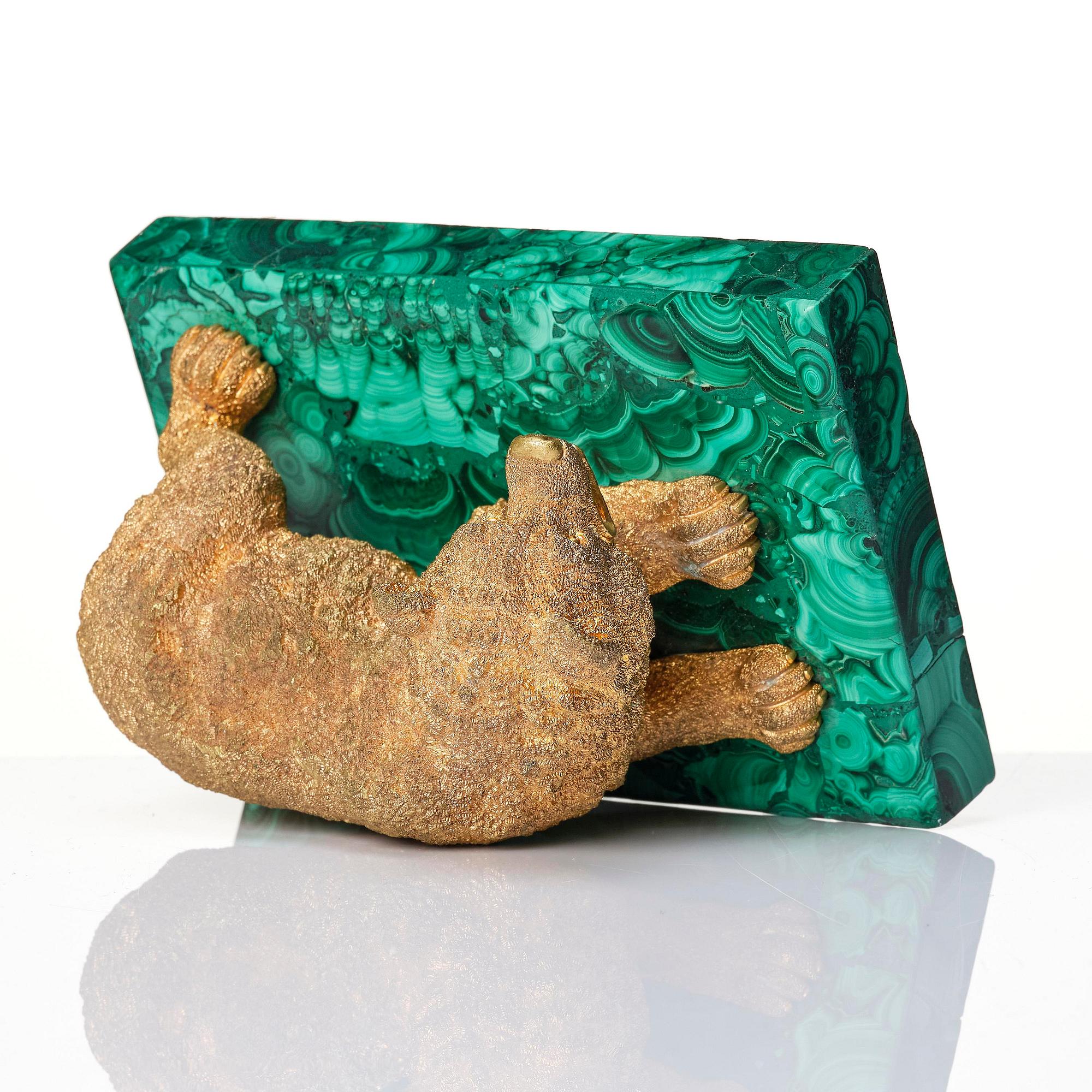 A Russian Nicholas II malachite-veneered and ormolu paperweight, late 19th century.