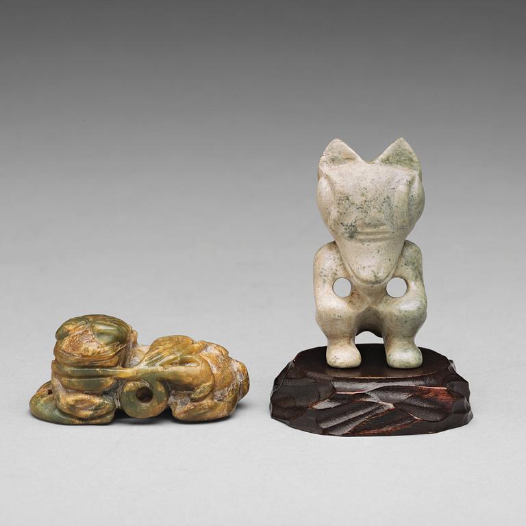 Two archaistic stone sculptures.