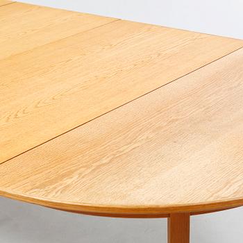 A dining table designed by Carl Malmsten and named "Calmare Nyckel".