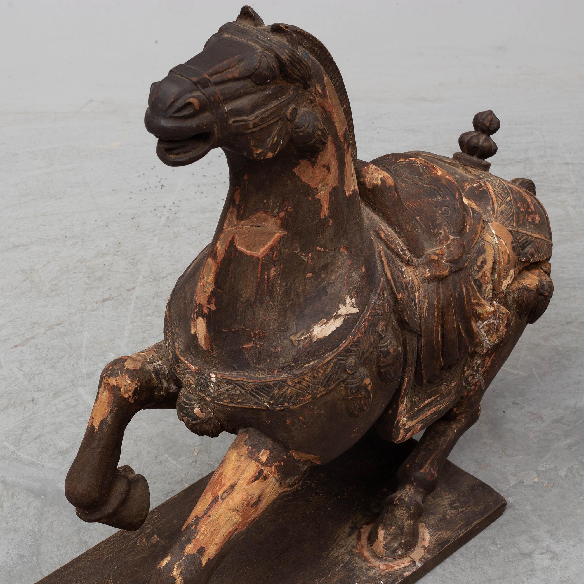 Two large wooden sculptures of horses, 20th century.
