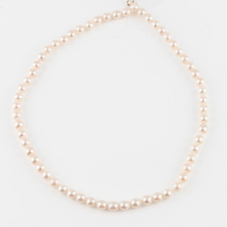 Three strands of cultured pearls, without clasps.