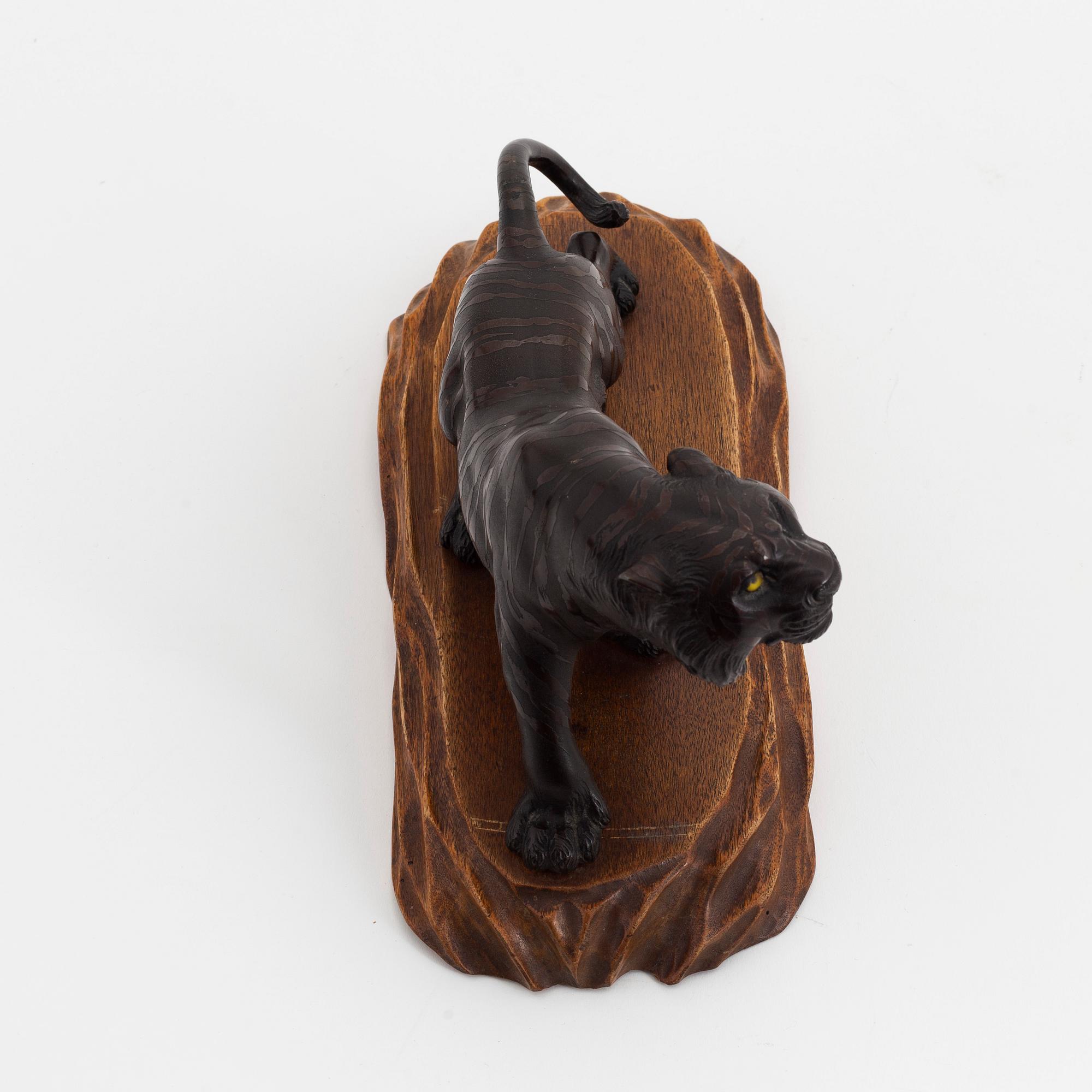 A bronze okimono/sculpture in the shape of a tiger, first half of the 20th Century.