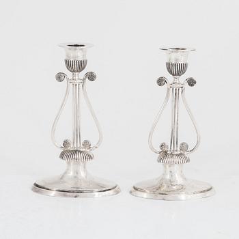 A pair of Swedish silver Empire candlesticks, mark of Gustaf Folcker, Stockholm 1814.