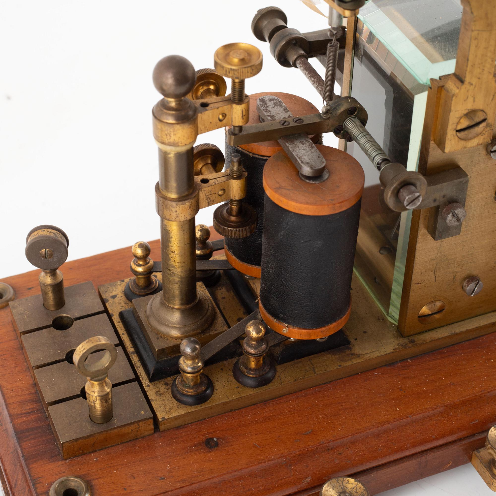 A telegraph from LM Ericsson, and a telegraph key from Digney Frères, early 20th century.