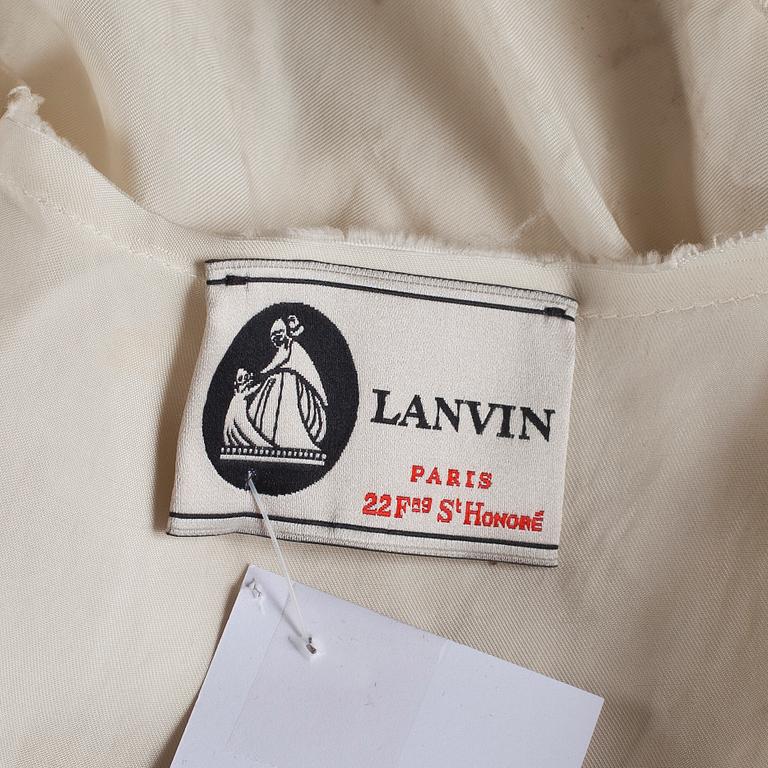 A white silk cocktail dress by Lanvin.