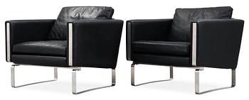 50. A pair of Hans J Wegner steel and black leather 'CH-101' easy chairs, Carl Hansen & Son, Denmark.