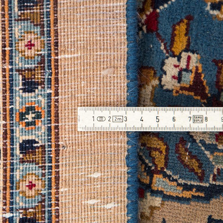 A carpet from Mashad, around 381 x 297 cm.