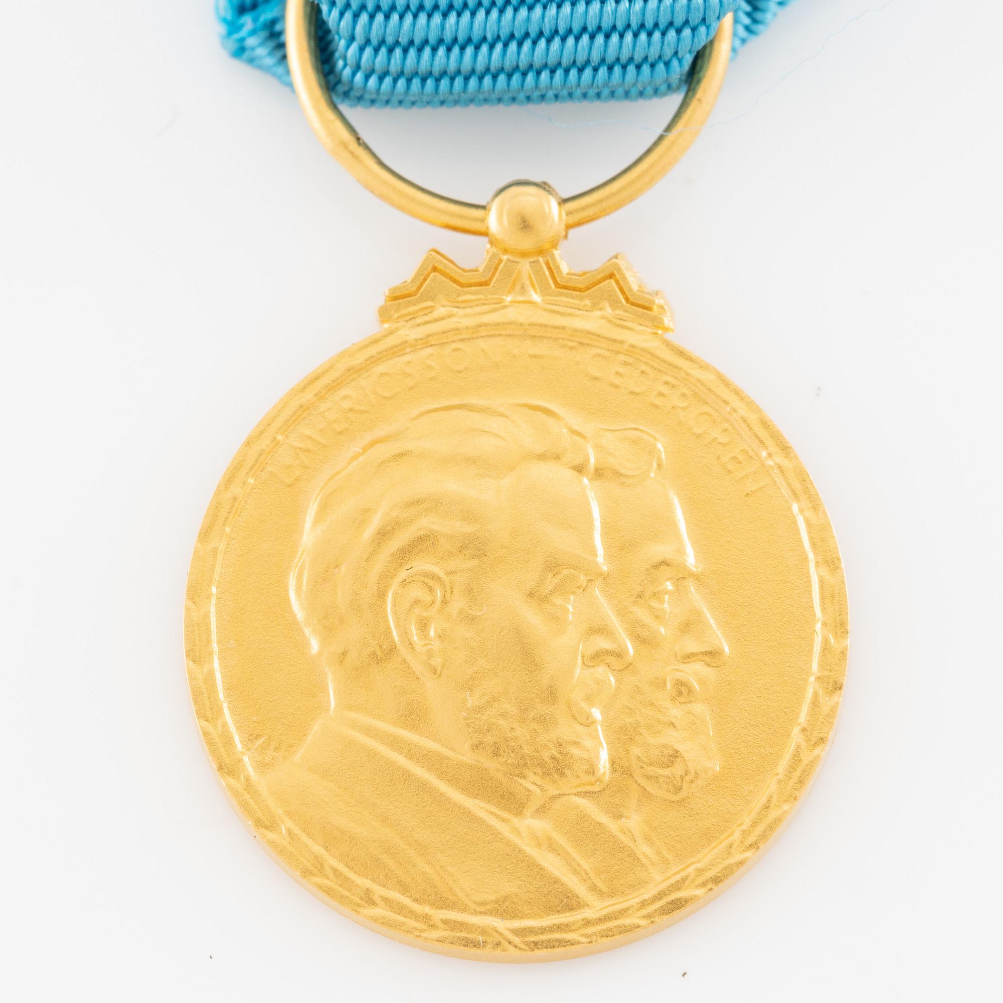 Medal, 14k gold, LM Ericsson, for merit and skill.