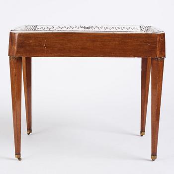 A Gustavian mahogany and faience tea table, late 18th century.