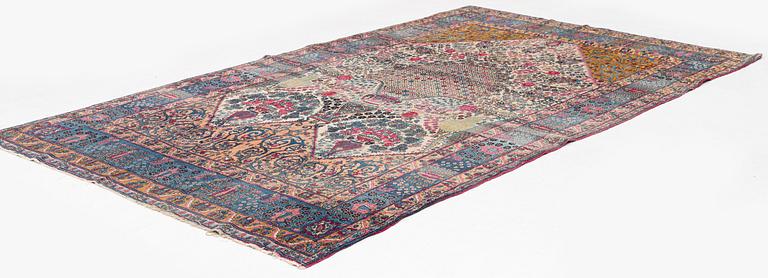 An antique Tehran carpet, north Persia, c. 323 x 195 cm.