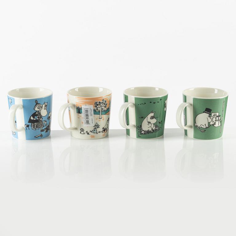 Four porcelain Moomin mugs, Arabia, Finland.