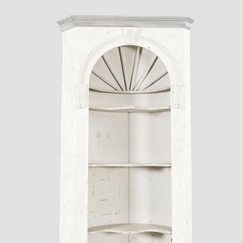 A painted Louis XVI style wallmounted corner cabinet.