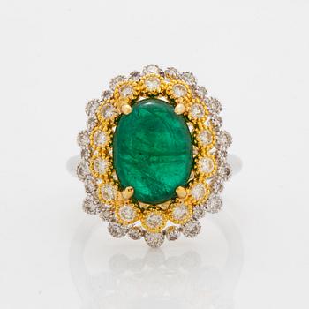 Cabochon-cut emerald and brilliant-cut diamond ring.