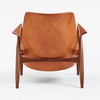 Ib Kofod-Larsen, a teak and cognac coloured leather 'Sälen' easy chair, Olof Perssons Fåtöljindustri (OPE), Sweden, 1950-60s.