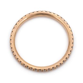 An eternity ring by Georg Jensen set with round, brilliant-cut diamonds.