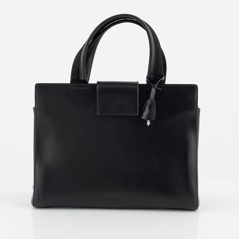 Prada, a black leather bag.