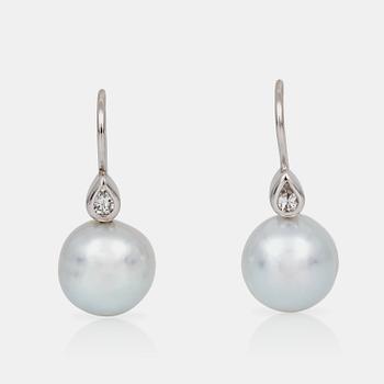 A pair of cultured South Sea pearl and diamond earrings. Total carat weight of diamonds 0.24 ct.