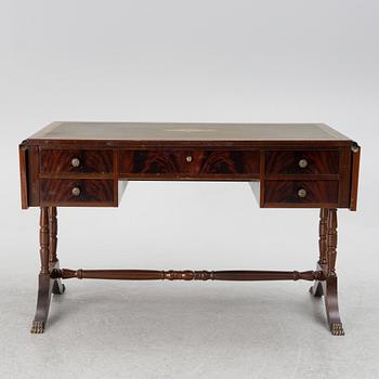 A mahogany veneer desk with desk chair, 20th Century.