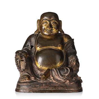 1077. A gilt bronze sculpture of Budai, Ming dynasty (1368-1644).