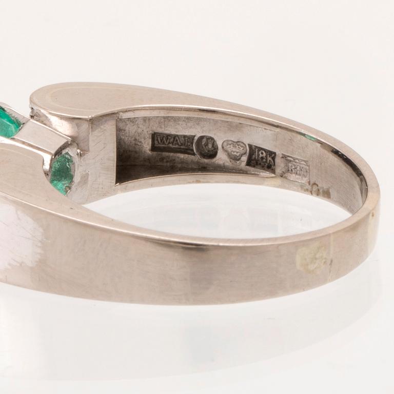 W.A. Bolin, ring 18K white gold with a rectangular step-cut emerald and round brilliant-cut diamonds, Stockholm 1976.